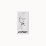 A package of 'Pomelo Blossom Essential Oil' by areme, featuring a white bottle with a label and a small bottle stopper adorned with a pomelo blossom design.