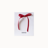 Red ribbon on a white box with 'areme' branding