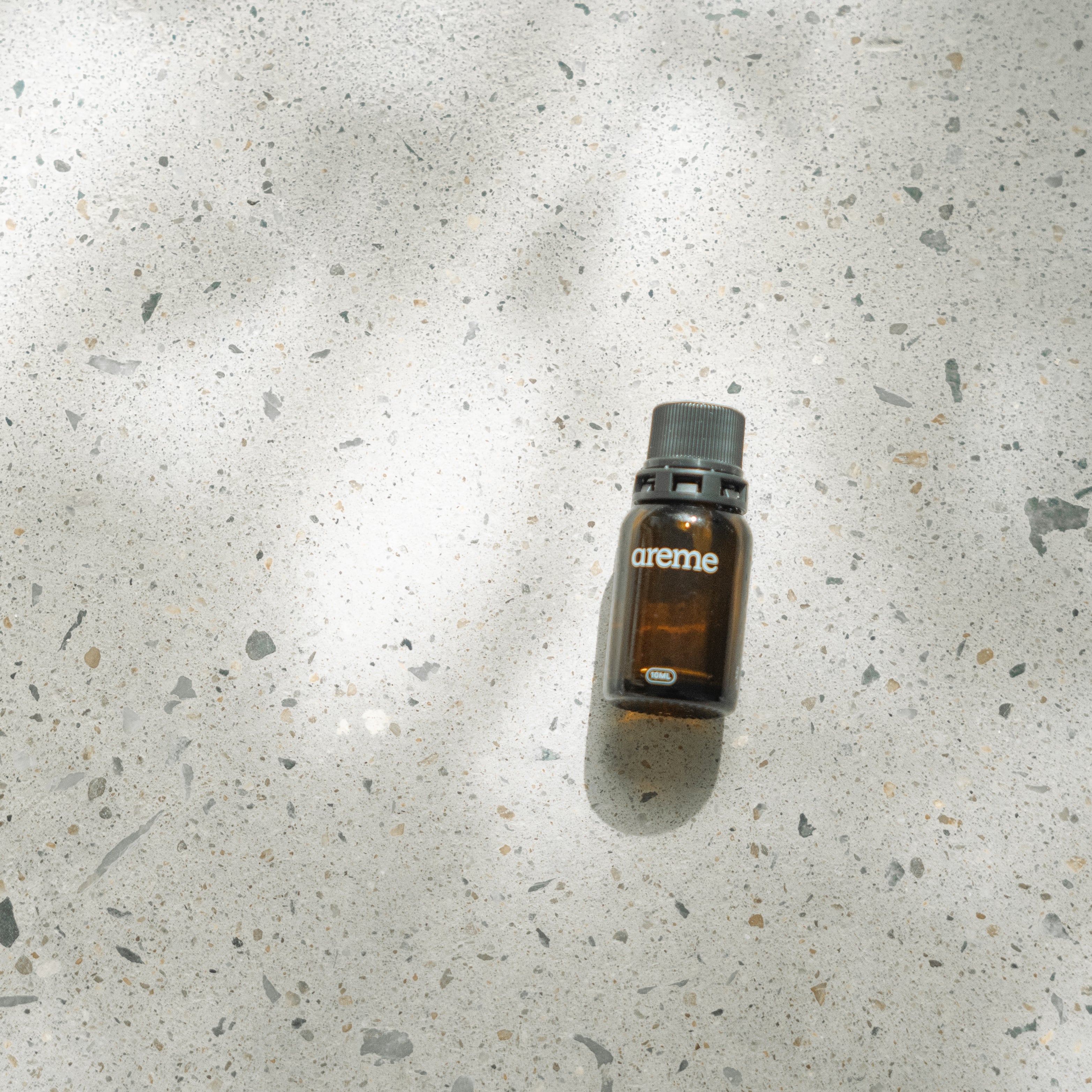 areme essential oil recycled glass bottle